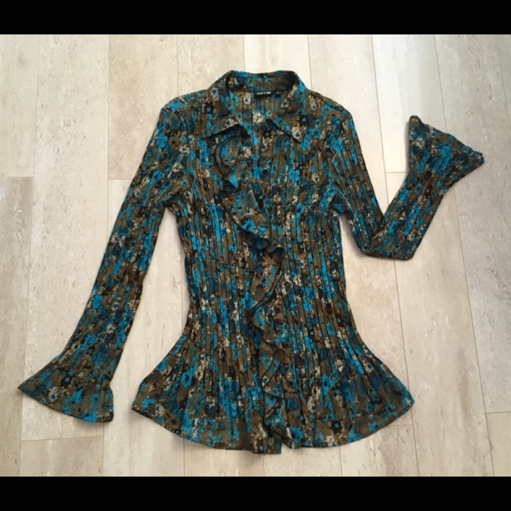 Stunning pleated blouse with flowing ruffles.